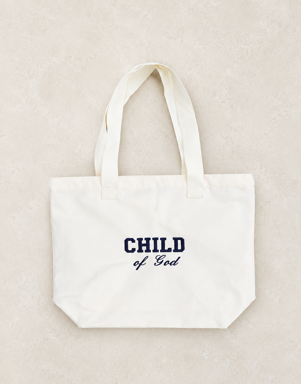 Totebag med broderad CHILD OF GOD text. 